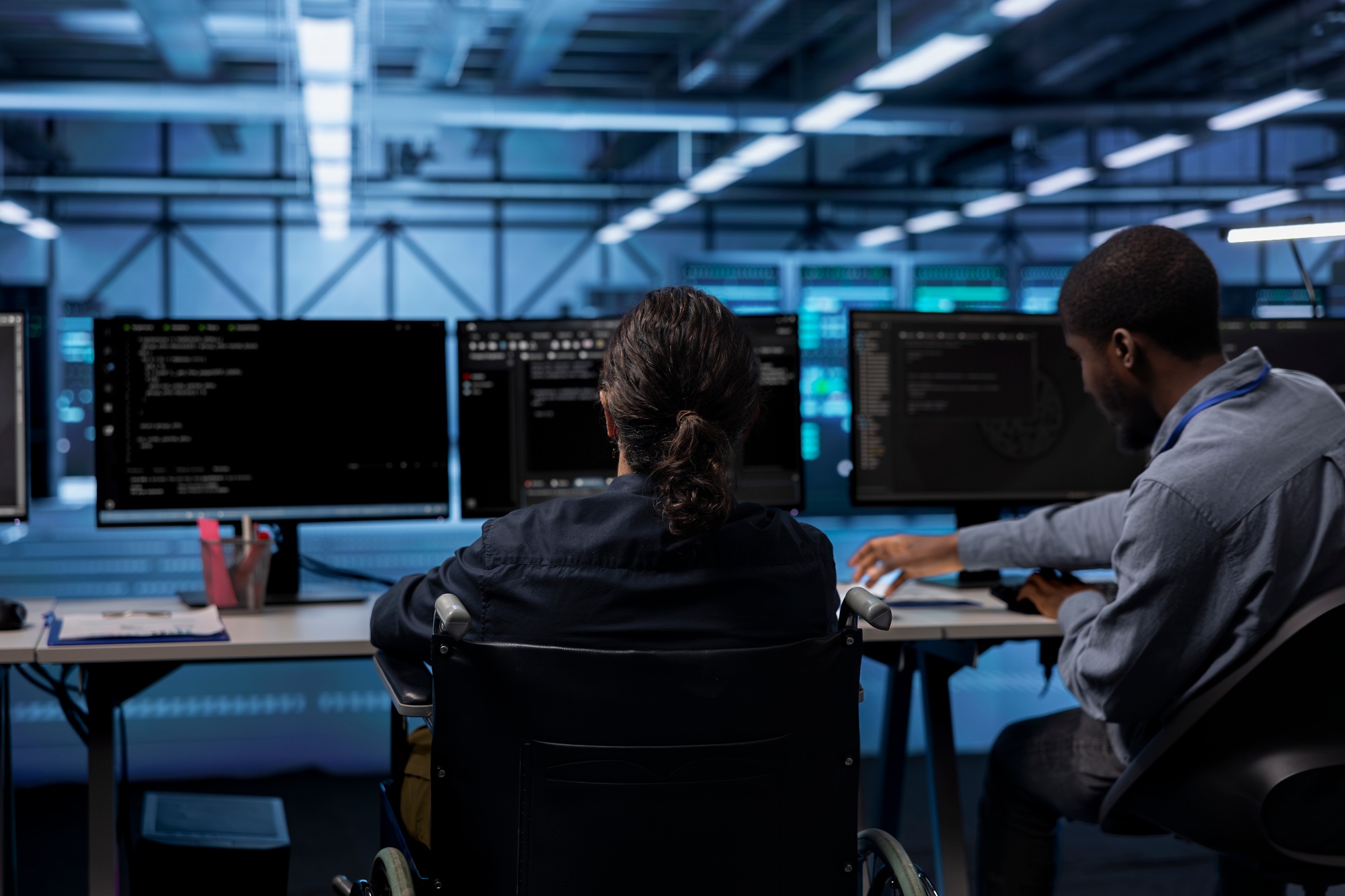 Person with paraplegia working in inclusive data center workplace